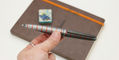 diplomat _elox_rings_ballpoint_pens_grey_orange_in_hand
